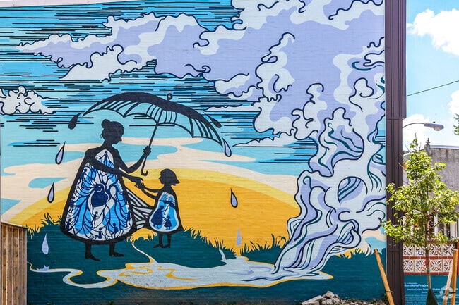 Beautiful murals can be found on the sides of many Kingsessing rowhomes.