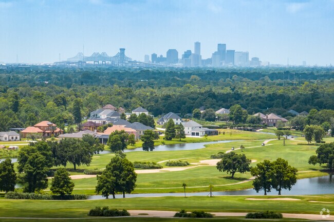Downtown New Orleans sits on the horizon of the English Turn in the New Aurora neighborhood.