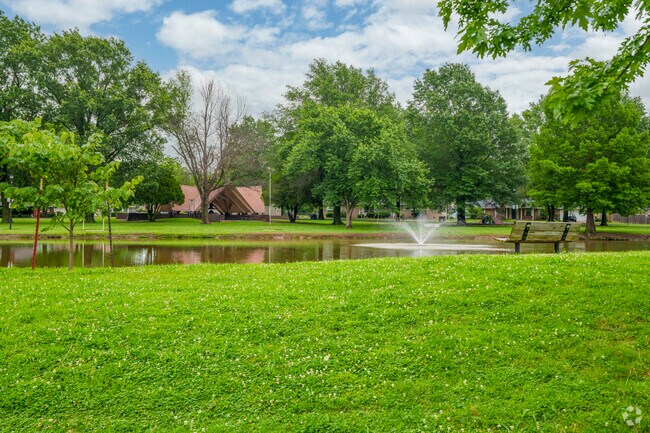 A peaceful view of the pond and fountain at Whitaker Park in Pryor Creek.