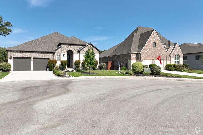 Spacious homes anchor this quiet cul-de-sac in Timberwood Park, surrounded by manicured lawns and peaceful suburban charm.