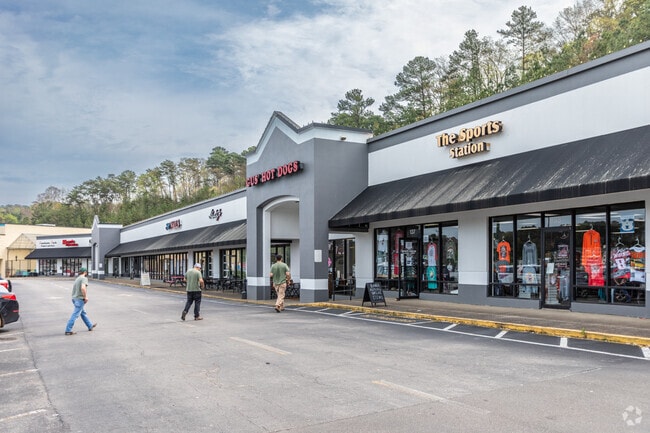 Several men head to a restaurant at Grants Mill Station shopping center.
