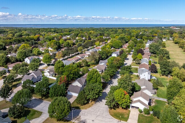 Most of the homes in Baird Creek have mature trees lining the streets.