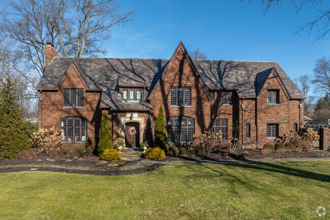 Tudor Revival-style manors are well maintained and highly coveted in the Merriman Hills neighborhood.