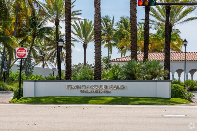 The Loggia Beach Park entrance sign notes Golden Beach, established in 1929.