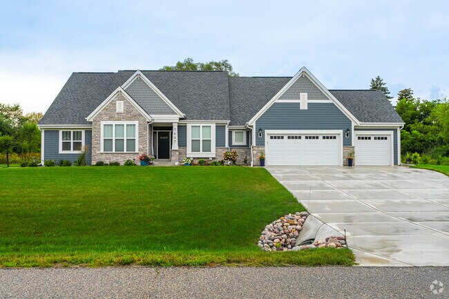 New Traditional homes near Lauderdale Lakes feature stone fronts and Craftsman-inspired details.