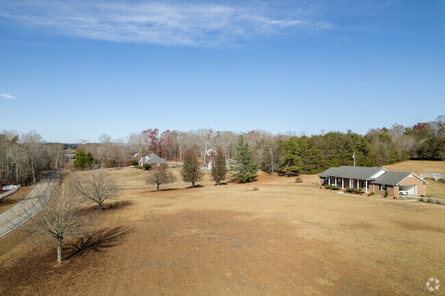 Many homes have large front yards and trees surrounding them in Holly Springs.