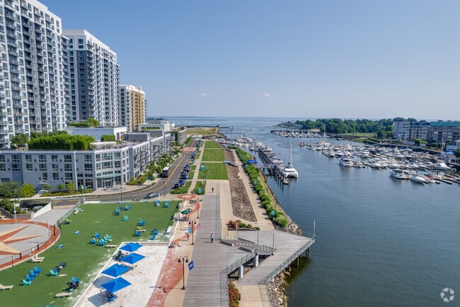 Residents enjoy walking along the Harbor Point Board Walk in Harbor Point.