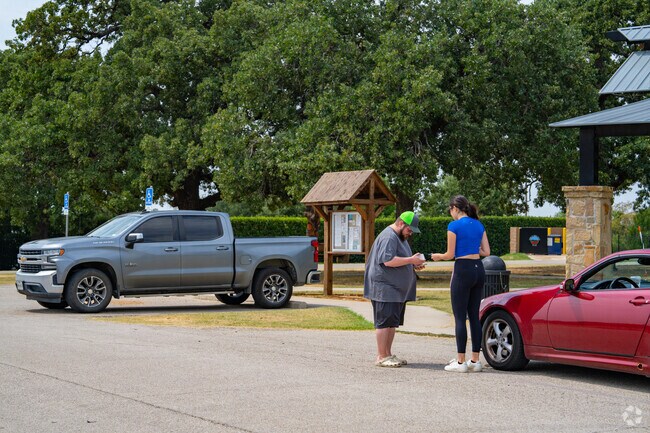 Locals enjoy the green space and community events at Cross Roads Town Park.