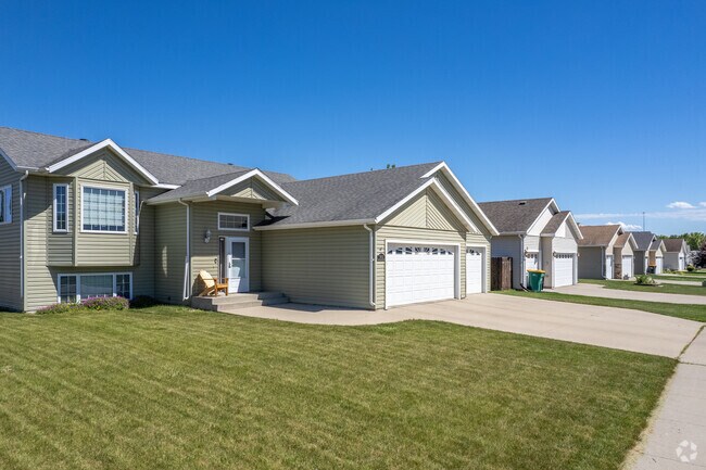 A row of single-family homes in Elmwood Court offers the perfect setting for family living.