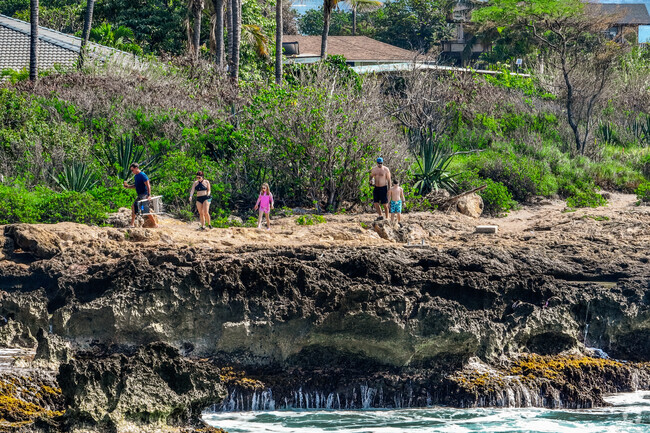 Maili's coastline is full of rugged beauty.
