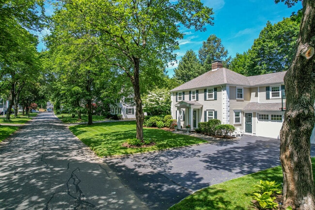 Colonials homes with driveways in Morses Pond, Wellesley.