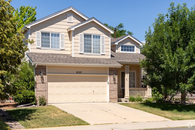 This Hampden Villas home features a two-car garage and a covered front porch.