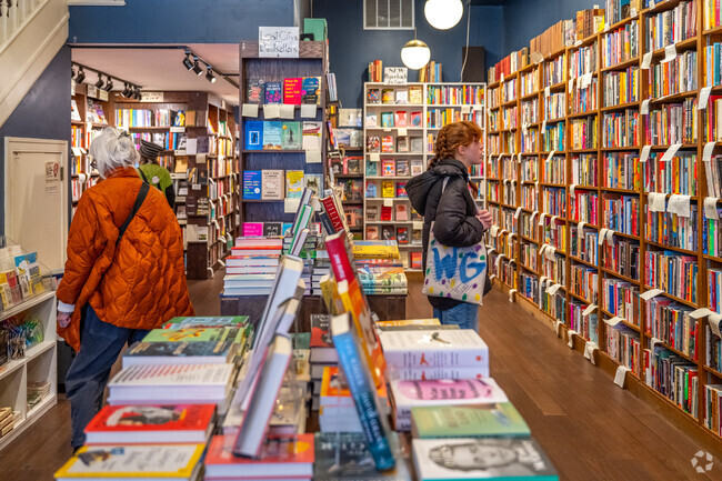 People browsing at Lost City Books on 18th St in Adams Morgan.