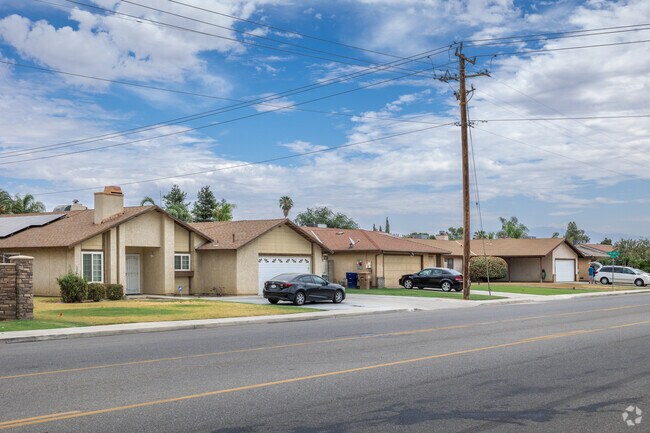 A row of single-family homes painted in earth-tones located in South Wible Orchard.