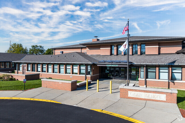 Flags flap in the wind outside Gavin Elementary School.