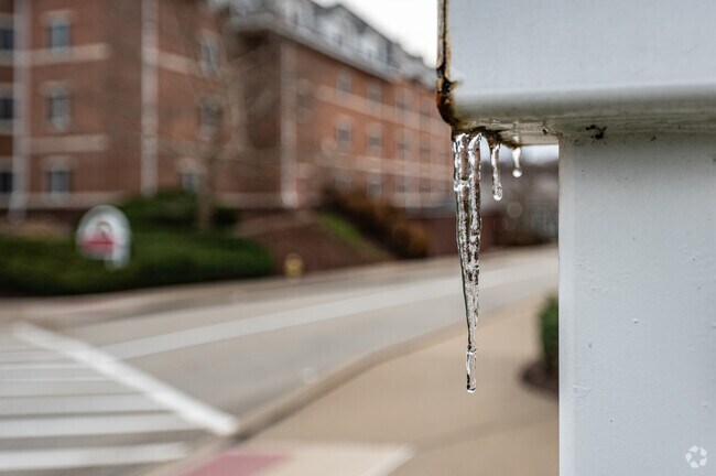 Icicles hang from a sign post as winter approaches in the small community of Masontown.