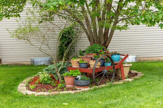 Residents of Sugar Grove-Indian Acres decorate their lawns with potted plants and landscaping.