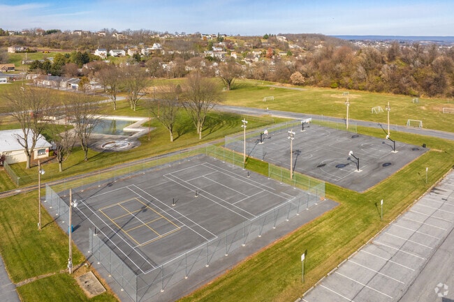 Locals play Pickle Ball at the courts at Cementon Park.