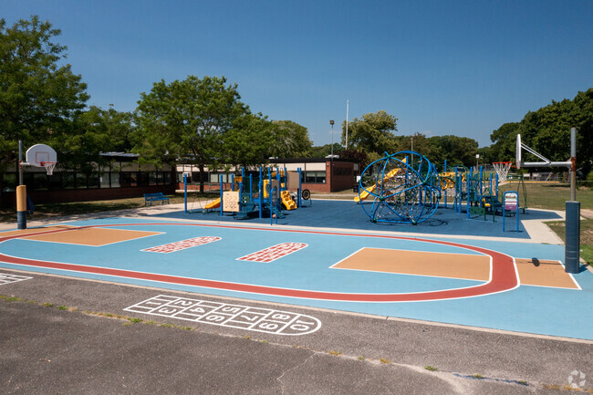 Play a friendly game of basketball on the court at the Manetuck Elementary School.