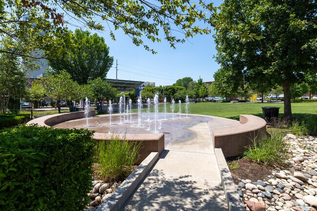 The fountain in the middle of Gutherie Green offers a place for residents to cool down.