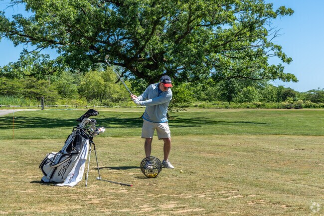 A man practices his drives at Thunderhawk Golf Club near Heatherstone.