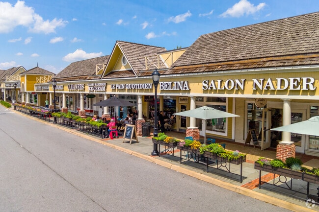 Local residents enjoy the afternoon at the Wildwood shopping center, located near Wyngate.