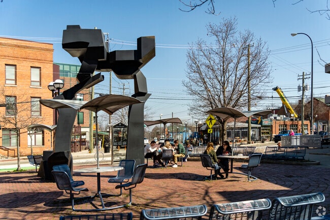 Downtown Ann Arbor workers relax at Sculpture Plaza during lunch breaks.
