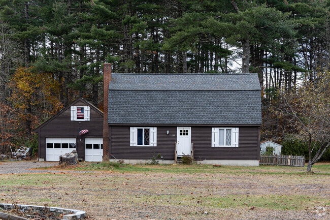 This one-story home with a gambrel roof is tucked away in Hollis.