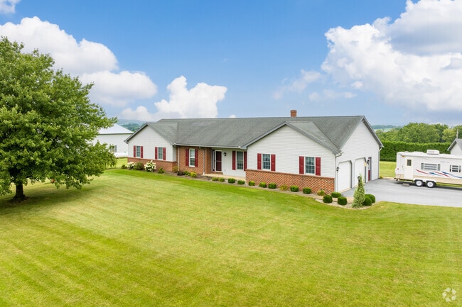 This ranch-style family home is surrounded by farms, offering country living in Clay.