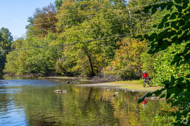 A biker stops to take in the view of the river on the Schuylkill River Trail.