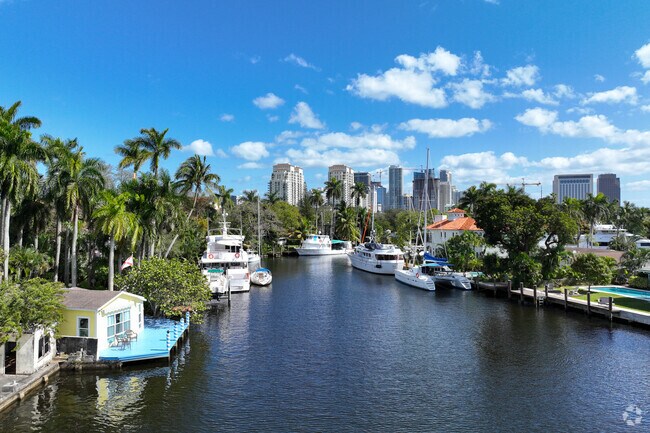 View of the river lined with boats and houses in Sailboat Bend.