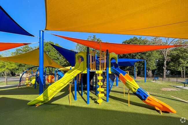 Children in Downtown Conway enjoy the colorful playground at Laurel Park, a favorite spot for outdoor fun and family activities.
