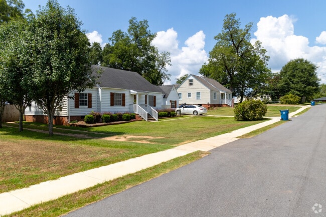 This peaceful suburban block features single-story homes, lush greenery, and a walkable layout.