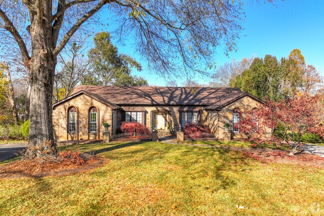 Large front yards and blooming gardens surround homes in the Hurstbourne neighborhood.