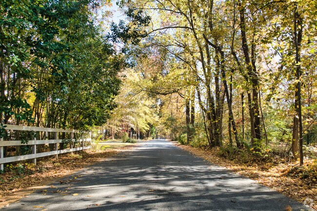 A forested landscape dominates most of the Cottrell Farms community.