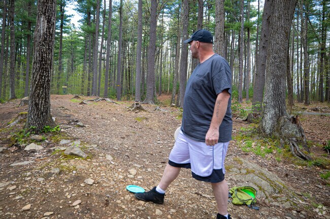 Locals are found spread about in Coggshall Park playing disc golf.