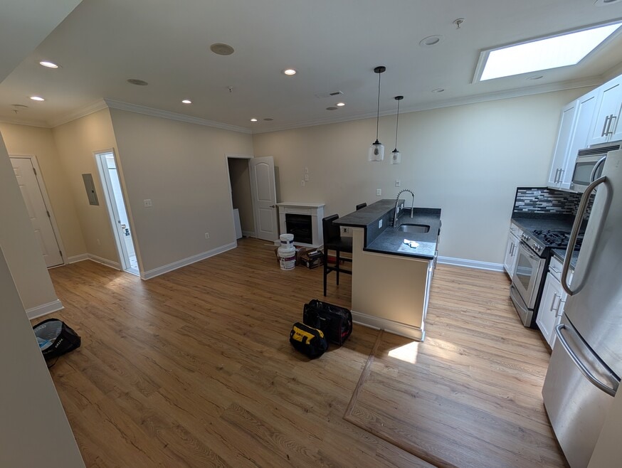 Living room with breakfast bar. Lots of natural light from windows and skylight