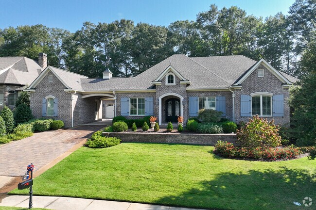 Luxury farmhouse style homes can be found around Cloverleaf with maintained landscaping.