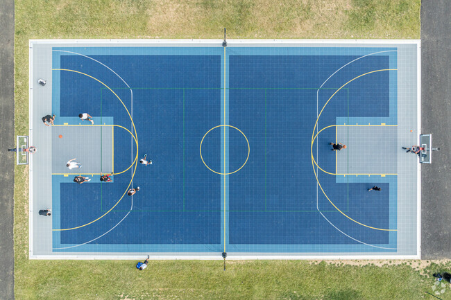 A beautiful, blue basketball court replaced the sloped court at Fairview Park.