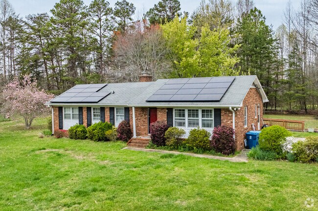 In Hodgin Valley, an older brick rancher is powered by solar panels.
