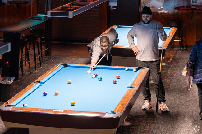 Enjoy a game of pool at Sam's Billiards, a favorite in Grant Park neighborhood.