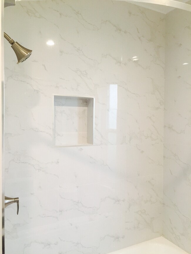 tiled bath walls and fixtures
