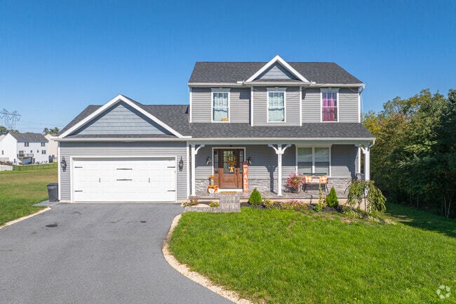 Escape the summer heat in Swatara under the covered front porch of a new traditional home.