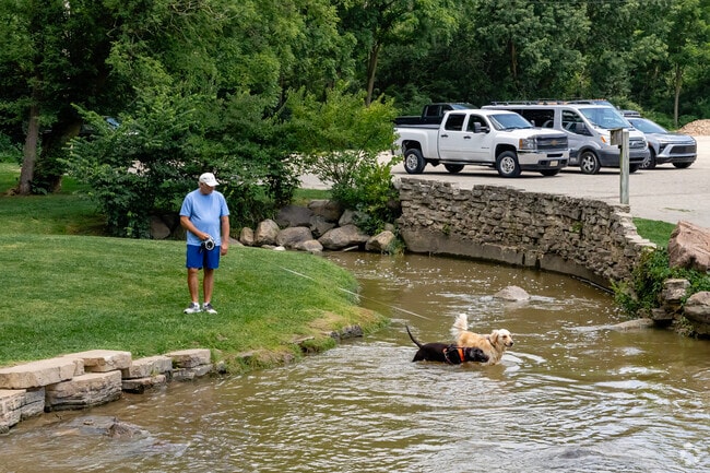 Mill Pond Park in Saline welcomes pets with a pond and a fenced dog park for off-leash fun.