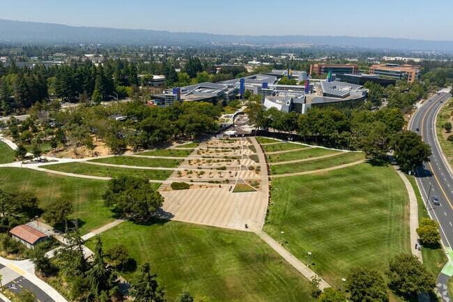 Green lawns with stripes of sidewalks running through them at Charleston Park.