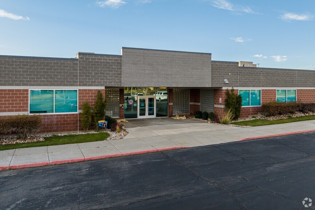 The entrance at Davis Connect 7-8 School is made of off red and grey bricks.