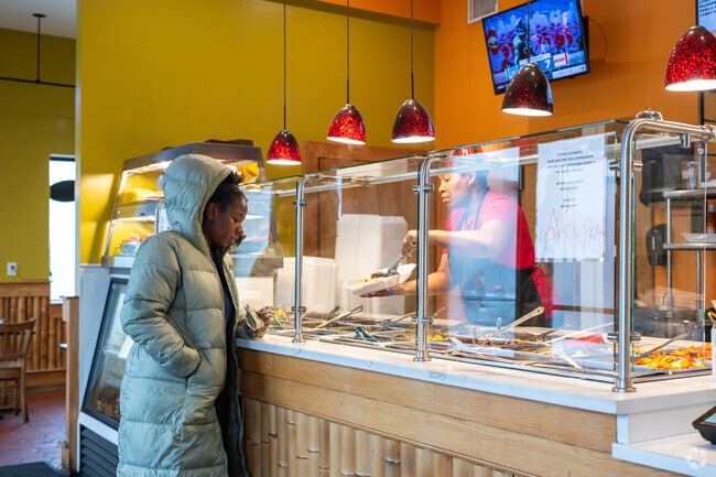 Flames in Downtown Randolph, take your tastebuds to the Caribbean.