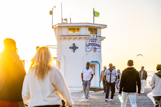 Portafina is a short drive to downtown, where residents can walk along Main Beach and pass by the iconic lifeguard tower.