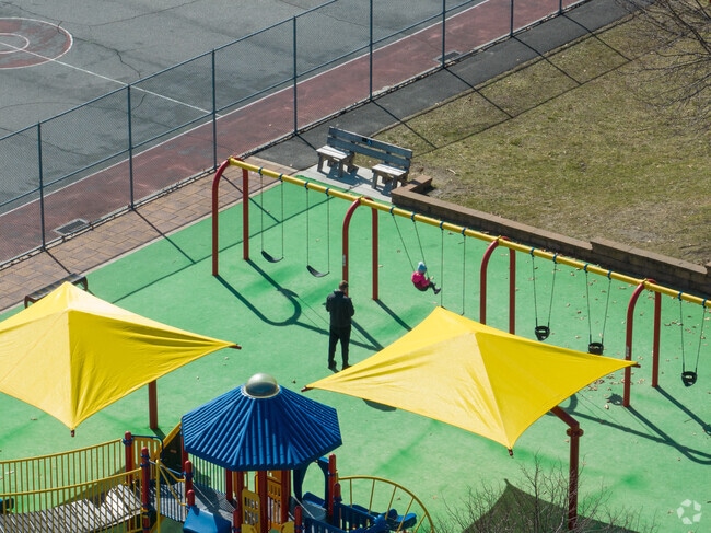 Aerial view of children on swings at Andreoli Park in Nesconset, New York.