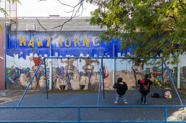 After school some kids stop at the Hawthorne Cultural Center & Playground to play in Hawthorne.